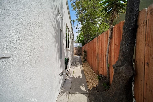 view of home's exterior featuring stucco siding and a fenced backyard