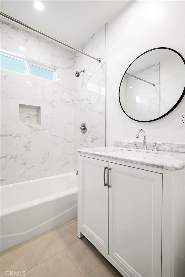 bathroom featuring bathtub / shower combination and vanity