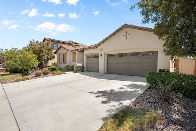 30156 Bristol Gate Ln, Menifee, CA 92584 - mediterranean / spanish house with a garage, driveway, stucco siding, and a tiled roof