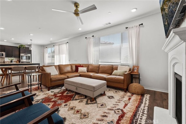 30156 Bristol Gate Ln, Menifee, CA 92584 - living room featuring wood finished floors, recessed lighting, a ceiling fan, and a fireplace