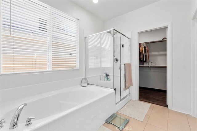30156 Bristol Gate Ln, Menifee, CA 92584 - full bath with a garden tub, a stall shower, a walk in closet, and tile patterned floors