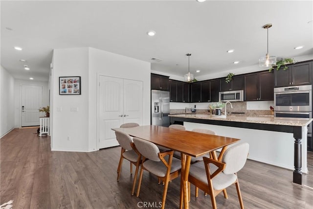 30156 Bristol Gate Ln, Menifee, CA 92584 - dining room with wood finished floors, recessed lighting, and baseboards