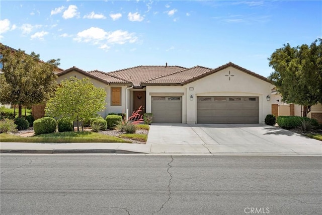 30156 Bristol Gate Ln, Menifee, CA 92584 - mediterranean / spanish-style home with an attached garage, stucco siding, driveway, and a tiled roof