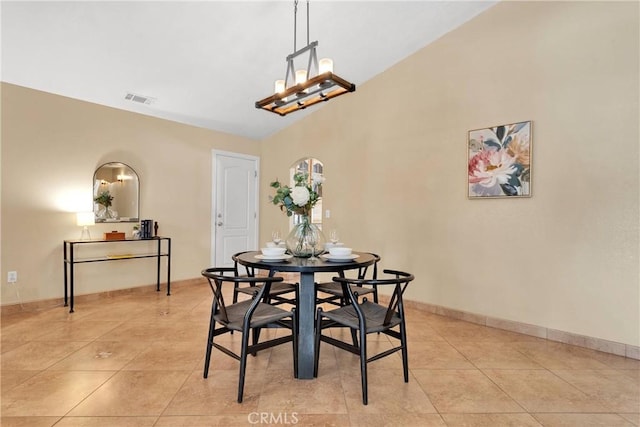 16158 Rimrock Rd, Apple Valley, CA 92307 - dining space featuring light tile patterned flooring, a chandelier, lofted ceiling, and baseboards
