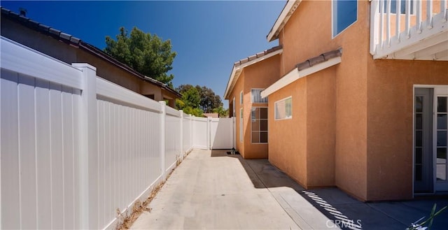 31695 Corte Avalos, Temecula, CA 92592 - view of side of property featuring a patio and stucco siding