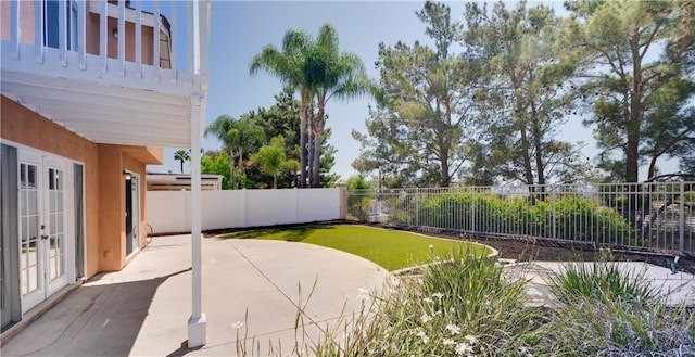 31695 Corte Avalos, Temecula, CA 92592 - fenced backyard featuring french doors and a patio area