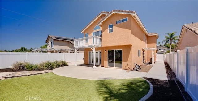 31695 Corte Avalos, Temecula, CA 92592 - rear view of house featuring a fenced backyard, a patio area, stucco siding, and a balcony