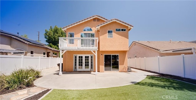 31695 Corte Avalos, Temecula, CA 92592 - rear view of house with french doors, a balcony, stucco siding, a fenced backyard, and a patio