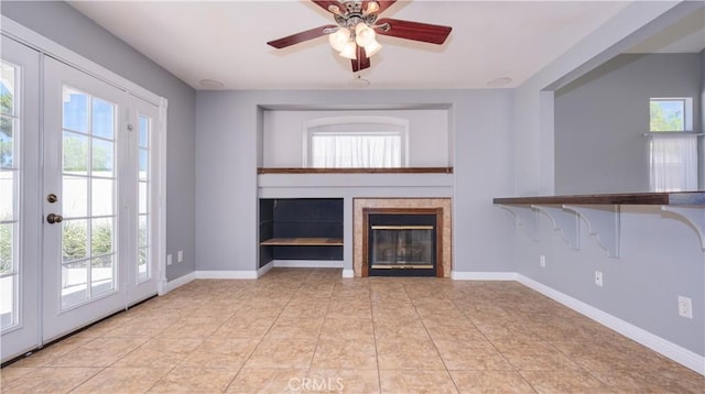 31695 Corte Avalos, Temecula, CA 92592 - unfurnished living room with a glass covered fireplace, ceiling fan, and tile patterned flooring