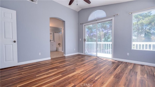 31695 Corte Avalos, Temecula, CA 92592 - unfurnished room featuring arched walkways, ceiling fan, wood finished floors, plenty of natural light, and vaulted ceiling