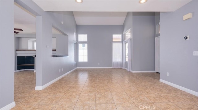 31695 Corte Avalos, Temecula, CA 92592 - empty room with plenty of natural light, a ceiling fan, recessed lighting, and light tile patterned flooring