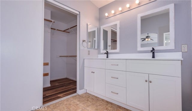 31695 Corte Avalos, Temecula, CA 92592 - bathroom with double vanity, ceiling fan, and a walk in closet