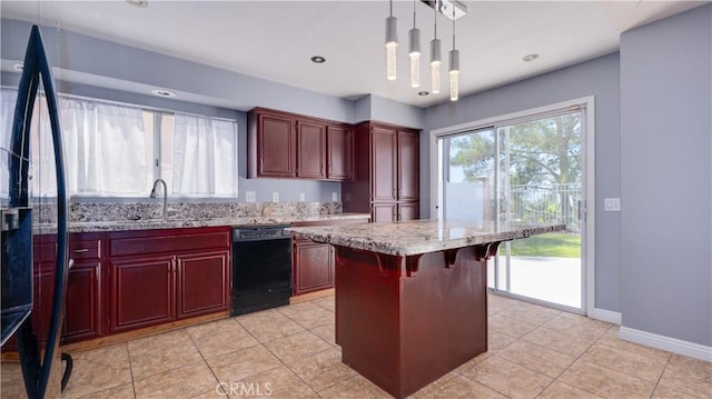 31695 Corte Avalos, Temecula, CA 92592 - kitchen with black appliances, reddish brown cabinets, light stone countertops, pendant lighting, and a kitchen bar