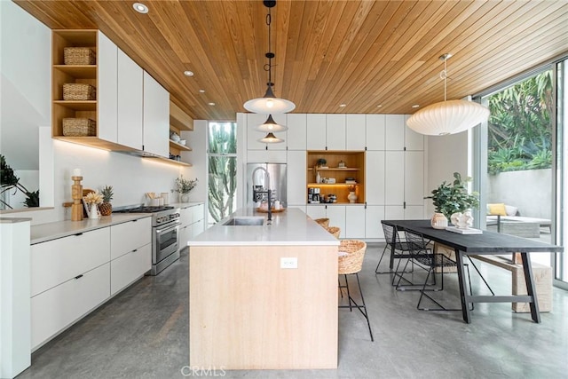 1357 Voorhees Ave, Manhattan Beach, CA 90266 - kitchen with open shelves, stainless steel appliances, concrete floors, modern cabinets, and wood ceiling