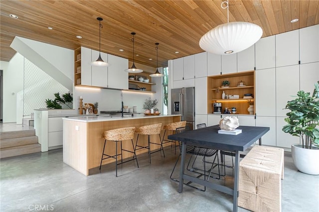 1357 Voorhees Ave, Manhattan Beach, CA 90266 - kitchen featuring open shelves, high quality fridge, wood ceiling, concrete flooring, and modern cabinets