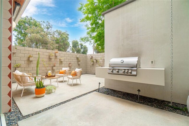 1357 Voorhees Ave, Manhattan Beach, CA 90266 - fenced backyard featuring area for grilling, a patio area, and an outdoor living space