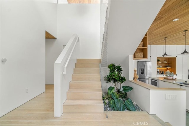 1357 Voorhees Ave, Manhattan Beach, CA 90266 - stairs featuring wood finished floors