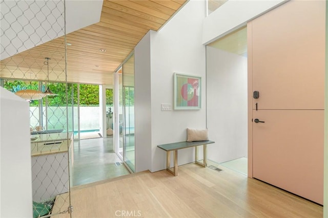 1357 Voorhees Ave, Manhattan Beach, CA 90266 - hallway with wood finished floors, wood ceiling, and a wall of windows