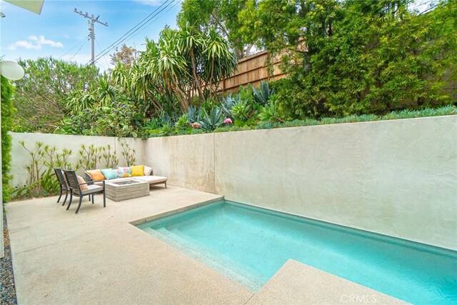 1357 Voorhees Ave, Manhattan Beach, CA 90266 - view of pool with an outdoor living space with a fire pit, a patio area, and a fenced backyard