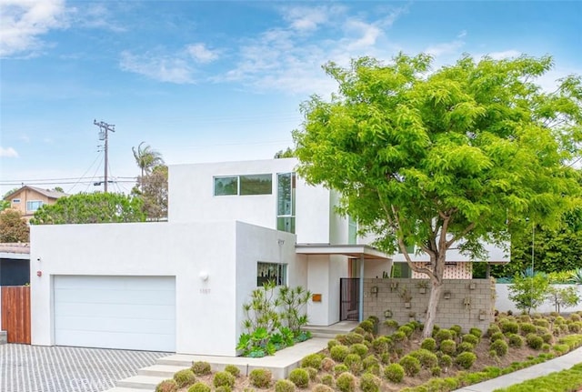 1357 Voorhees Ave, Manhattan Beach, CA 90266 - contemporary house with stucco siding, a garage, and driveway