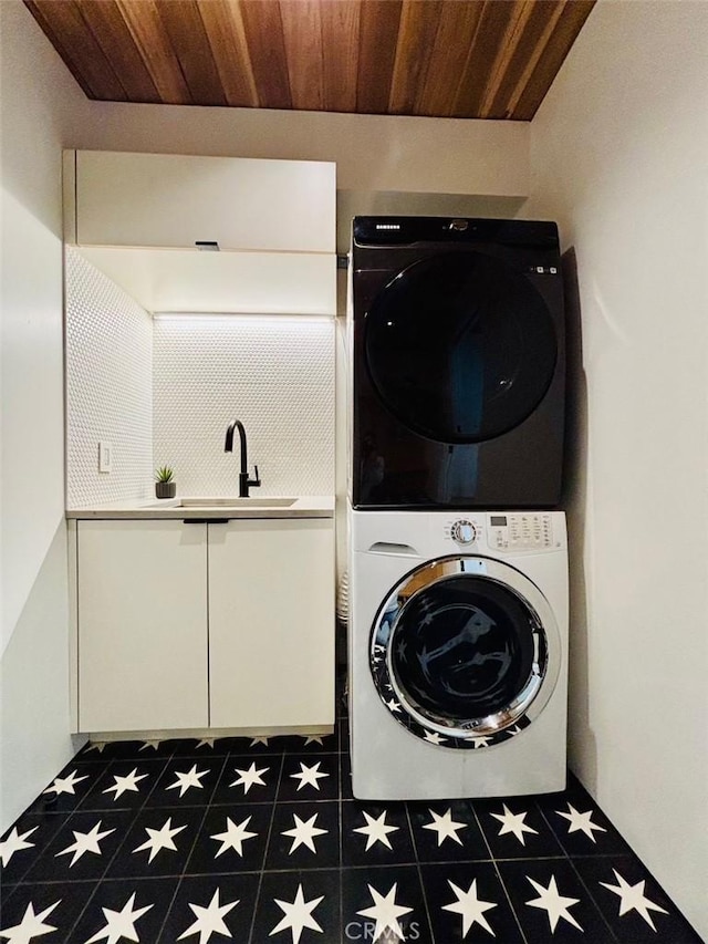 1357 Voorhees Ave, Manhattan Beach, CA 90266 - laundry area with stacked washing machine and dryer and wood ceiling