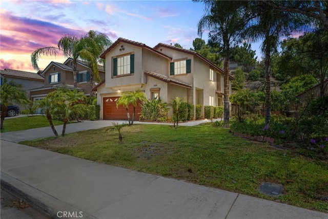 16200 Setting Sun Cir, Riverside, CA 92503 - mediterranean / spanish house with stucco siding, driveway, an attached garage, a front yard, and a tiled roof