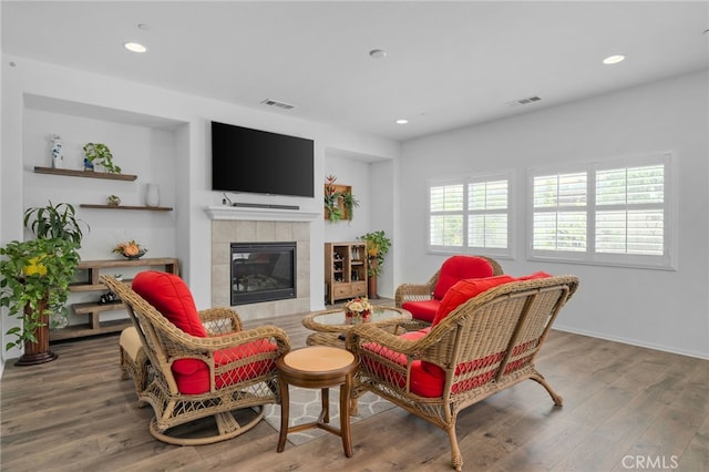 4736 Marrieta St, Jurupa Valley, CA 91752 - living room featuring a tiled fireplace, wood finished floors, and recessed lighting