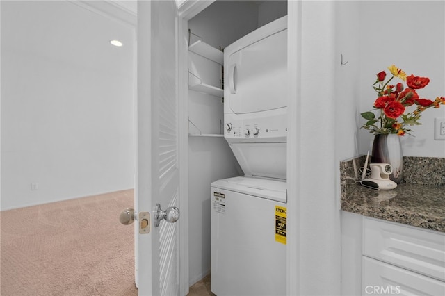 4736 Marrieta St, Jurupa Valley, CA 91752 - clothes washing area featuring stacked washing machine and dryer and carpet floors