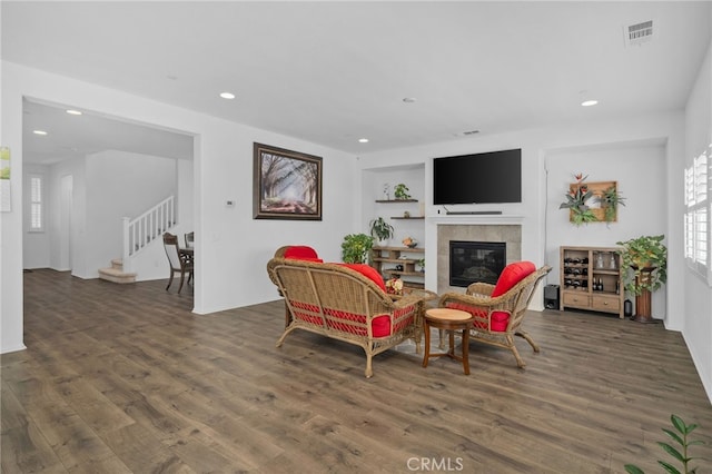 4736 Marrieta St, Jurupa Valley, CA 91752 - living room featuring wood finished floors, recessed lighting, a fireplace, stairway, and built in features