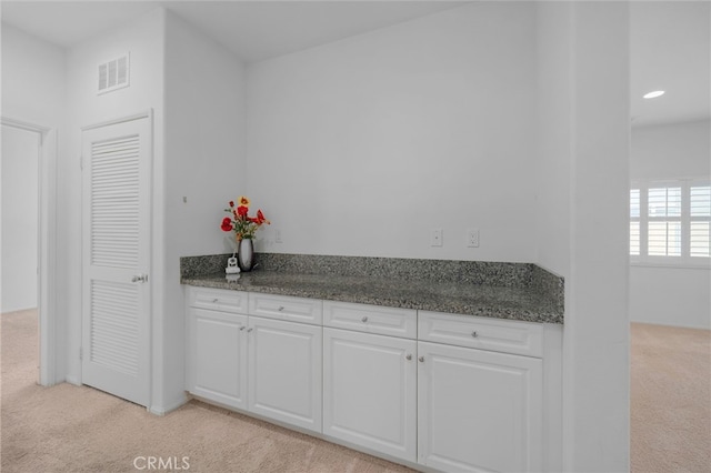 4736 Marrieta St, Jurupa Valley, CA 91752 - kitchen with light colored carpet and white cabinetry