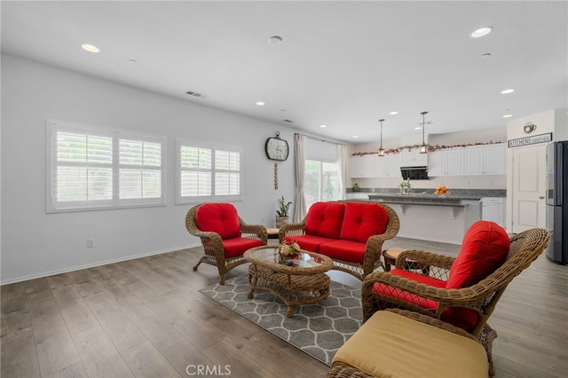 4736 Marrieta St, Jurupa Valley, CA 91752 - living area featuring light wood finished floors, recessed lighting, and baseboards