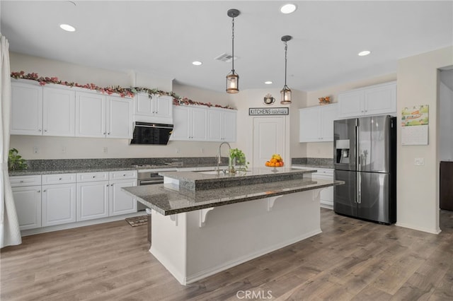 4736 Marrieta St, Jurupa Valley, CA 91752 - kitchen featuring stainless steel appliances, a sink, white cabinetry, recessed lighting, and a kitchen breakfast bar
