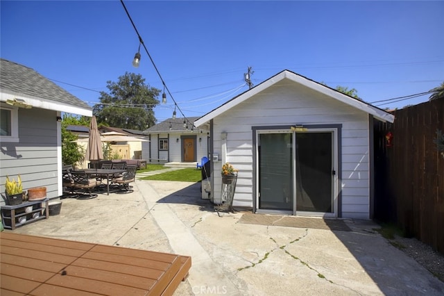 11101 Sarah St, Toluca Lake, CA 91602 - rear view of property with a patio area, fence, and outdoor dining space