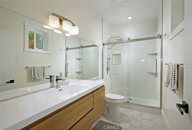 11101 Sarah St, Toluca Lake, CA 91602 - full bathroom with tile patterned flooring, a shower stall, toilet, and vanity
