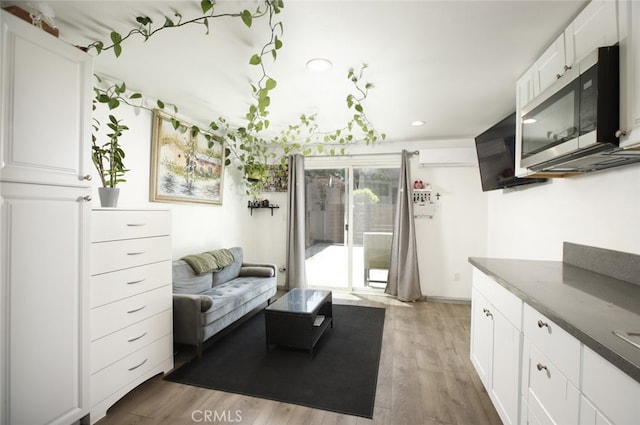 11101 Sarah St, Toluca Lake, CA 91602 - living room with wood finished floors and recessed lighting