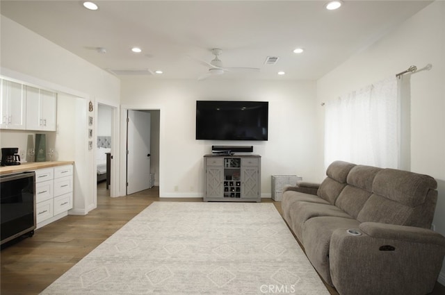 11101 Sarah St, Toluca Lake, CA 91602 - living area featuring wood finished floors, recessed lighting, a ceiling fan, a bar, and wine cooler