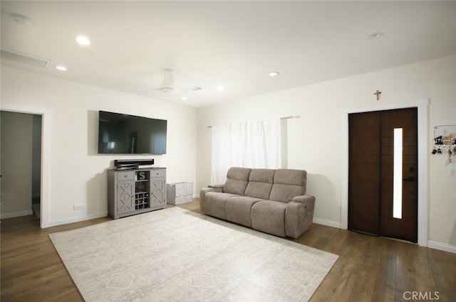 11101 Sarah St, Toluca Lake, CA 91602 - living room with wood finished floors, baseboards, and recessed lighting