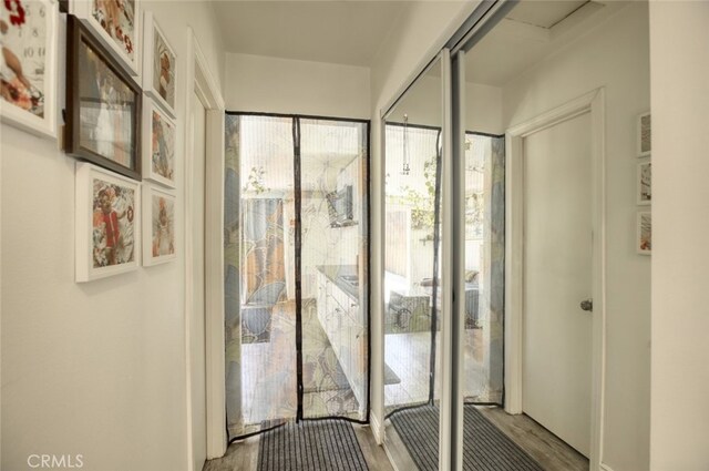 11101 Sarah St, Toluca Lake, CA 91602 - doorway with wood finished floors