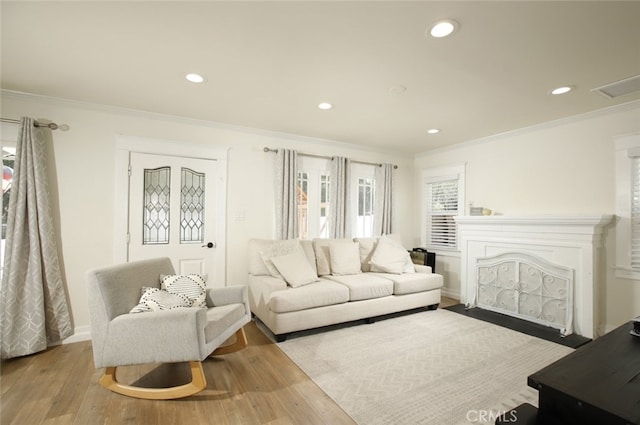 11101 Sarah St, Toluca Lake, CA 91602 - living room with ornamental molding, wood finished floors, recessed lighting, baseboards, and a fireplace with flush hearth