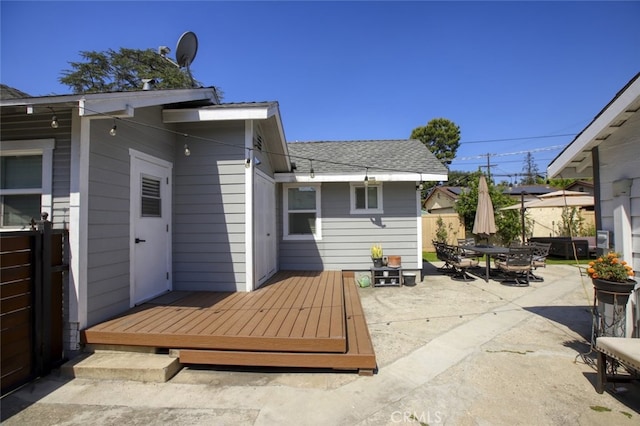 11101 Sarah St, Toluca Lake, CA 91602 - view of patio featuring outdoor dining space, a wooden deck, and fence