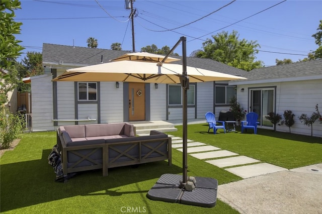 11101 Sarah St, Toluca Lake, CA 91602 - back of property with an outdoor hangout area and a yard