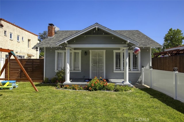 11101 Sarah St, Toluca Lake, CA 91602 - view of front of house featuring a porch, a chimney, and a shingled roof