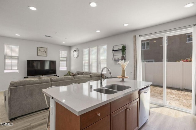 314 Hydrangea St, Fillmore, CA 93015 - kitchen with light wood-type flooring, light countertops, recessed lighting, stainless steel dishwasher, and a kitchen island with sink