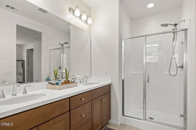 314 Hydrangea St, Fillmore, CA 93015 - full bath featuring a shower stall, double vanity, and tile patterned floors