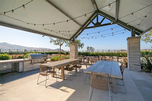 24 Vasto St, Rancho Mission Viejo, CA 92694 - view of patio / terrace featuring outdoor dining area, grilling area, exterior kitchen, and a mountain view