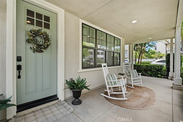 24 Vasto St, Rancho Mission Viejo, CA 92694 - doorway to property featuring covered porch and stucco siding