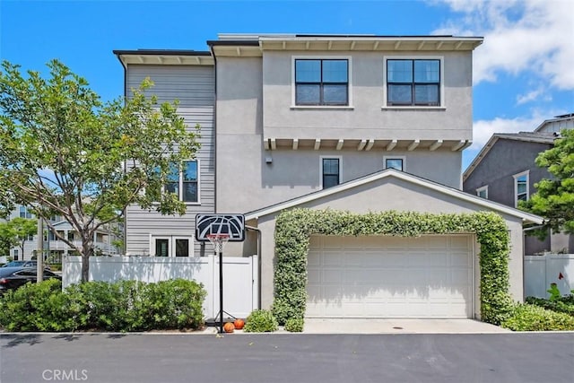 24 Vasto St, Rancho Mission Viejo, CA 92694 - view of front of property with fence, stucco siding, and asphalt driveway