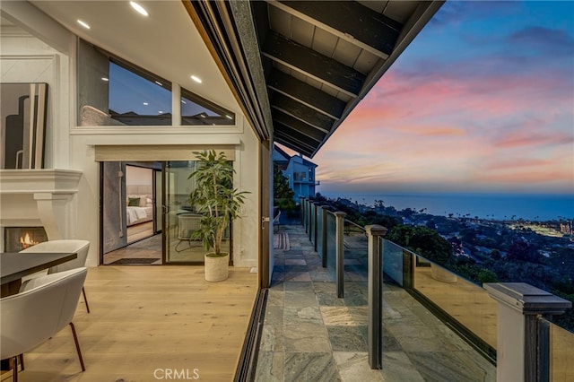 7655 Caminito Avola Ln, Jolla, CA 92037 - balcony at dusk with a lit fireplace