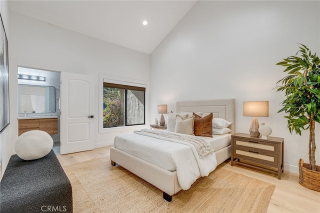 7655 Caminito Avola Ln, Jolla, CA 92037 - bedroom with high vaulted ceiling, light wood-style flooring, baseboards, ensuite bath, and recessed lighting