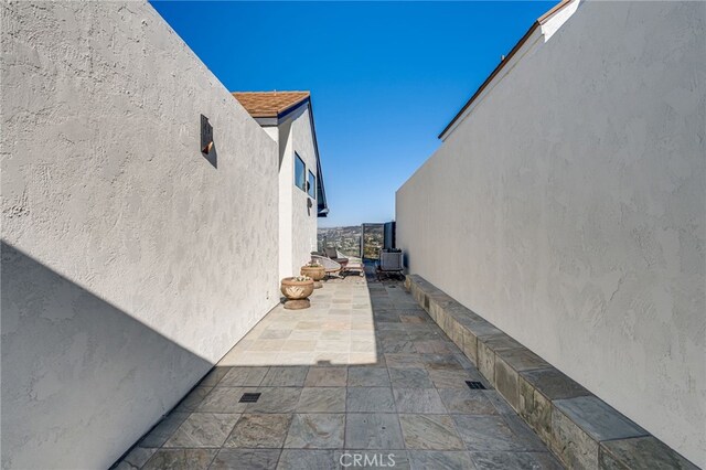 7655 Caminito Avola Ln, Jolla, CA 92037 - view of property exterior with stucco siding and a patio